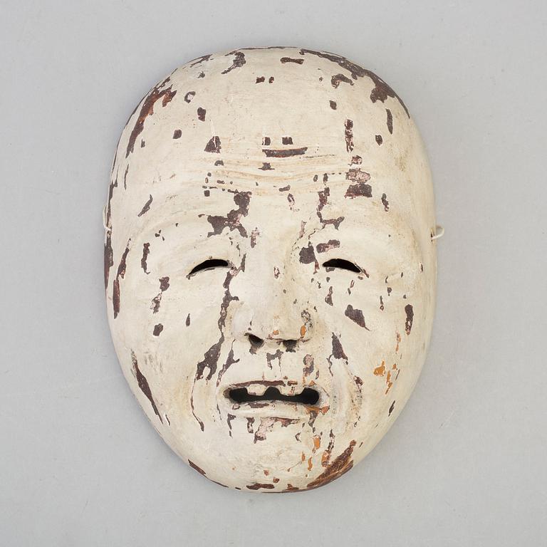 A Japanese wooden mask, 20th century.