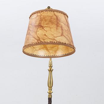 A floor lamp by Einar Bäckström, mid 20th century.