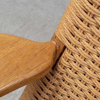A 'CH-25' armchair designed by Hans J Wegner for Carl Hansen & Søn, Denmark.
