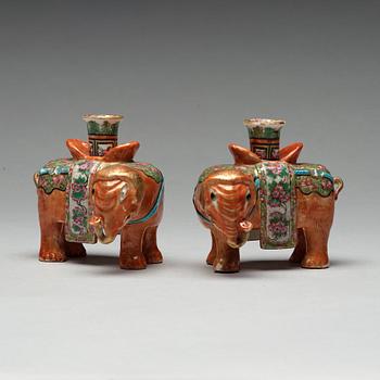 A pair of Canton candle sticks in the shape of elephants, Qing dynasty, 19th century.