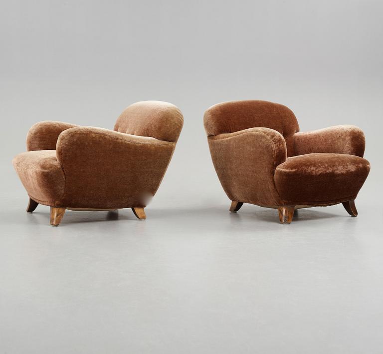 A pair of Mid century Modern easy chairs, probably 1939.