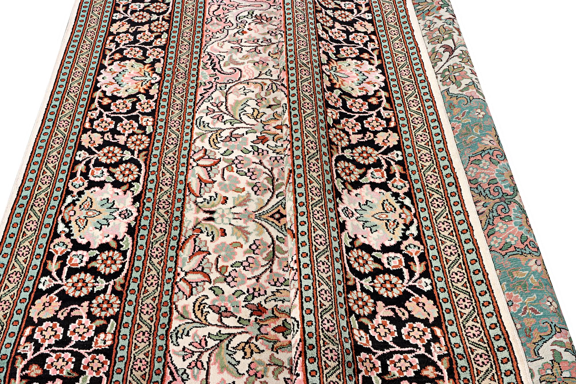 A silk Kashmir carpet, c. 267 x 185 cm.