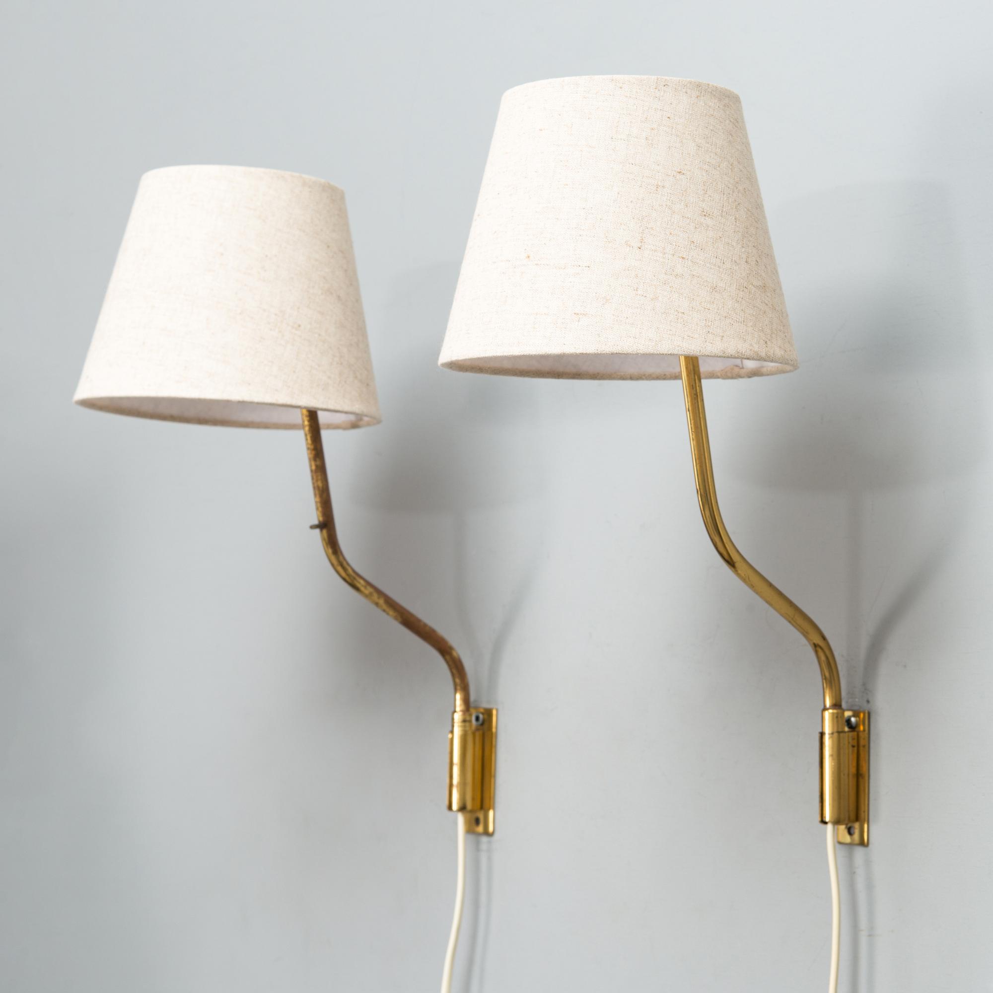 Lisa Johansson-Pape, Two mid-20th century '3053' wall lights for Stockmann Orno.