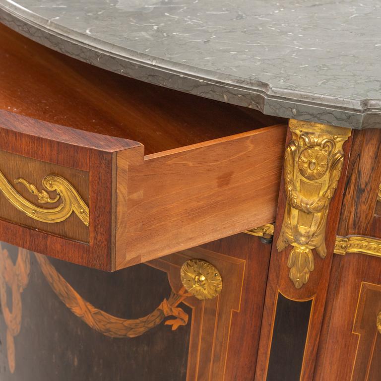 A Gustavian style cabinet with a stone top, 20th century.