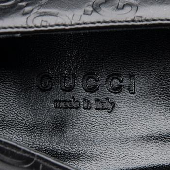 SKOR, Gucci.
