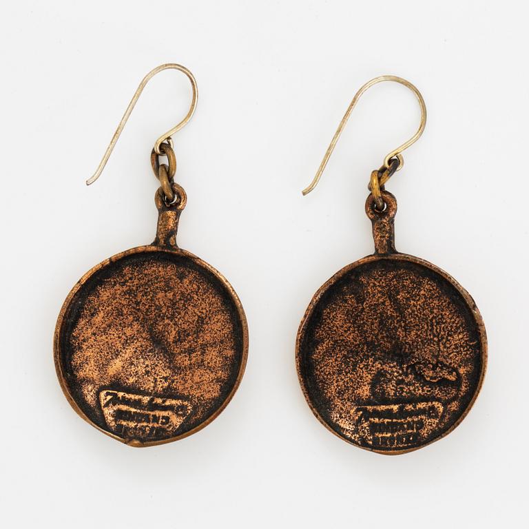 A pair of Jorma Laine earrings in bronze.