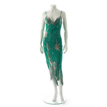 763. FABRICE, a green silk evening dress with glass bead embellishment.
