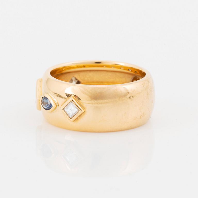 An 18K gold Cartier ring set with step-cut diamonds and faceted sapphires.