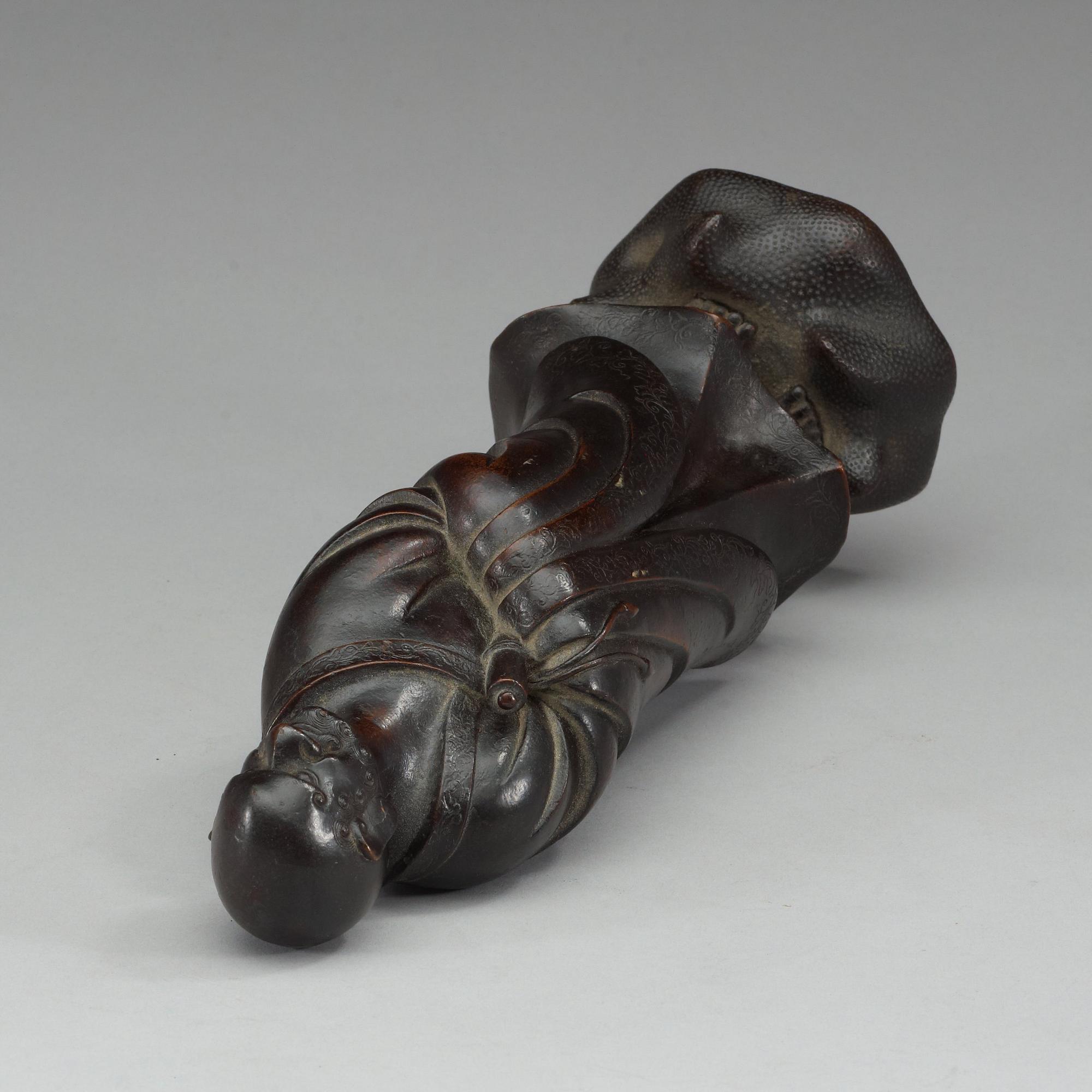 A bronze figure of one of the Lohans, Qing dynasty (1644-1912).