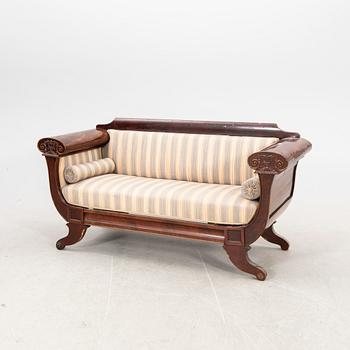 A mid 1800s late Empire mahogany sofa.