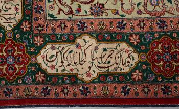 A carpet, semi-antique Tabriz, signed ca 335,5 x 256,5 - 261,5 cm.