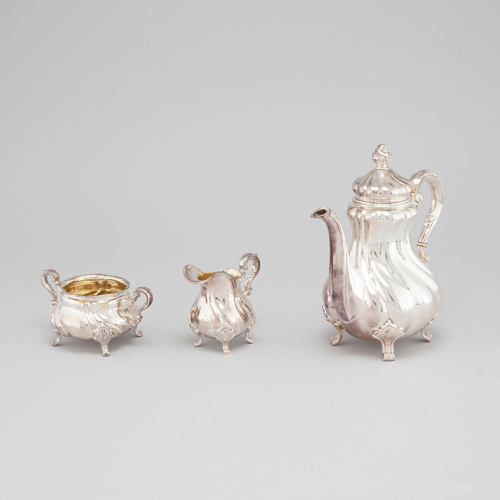 A silver coffee pot, creamer and sugar bowl with swedish import marks, 1930s.
