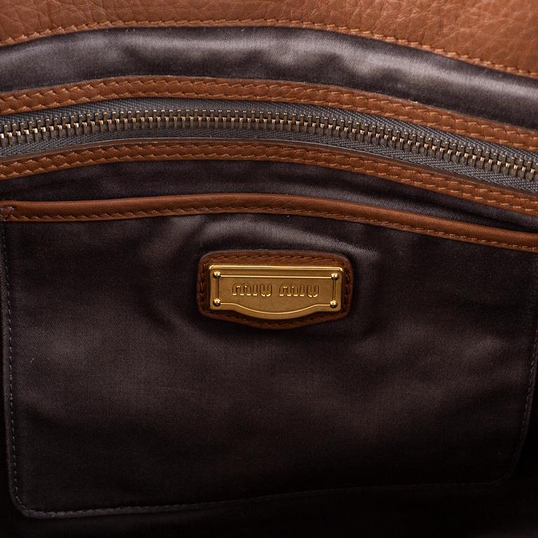 Miu Miu, a leather bag.