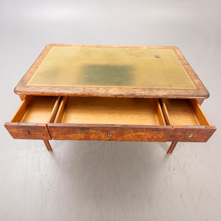 A mid 1800s birch Empire writing desk.