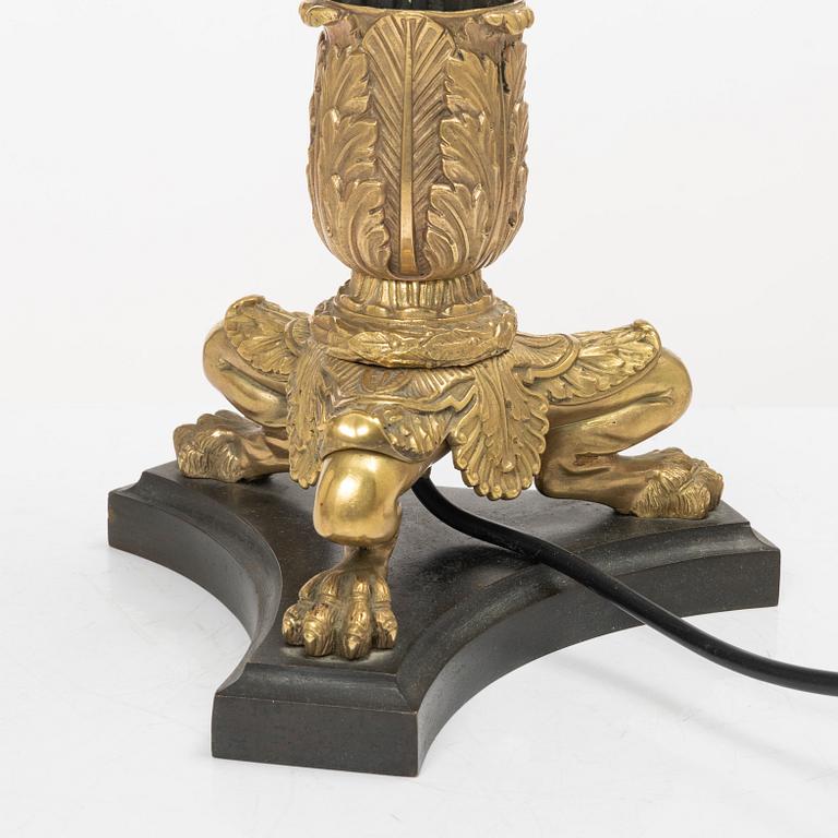 A pair of table lamps/reworked candle sticks, Empire, France, first half of the 20th century.