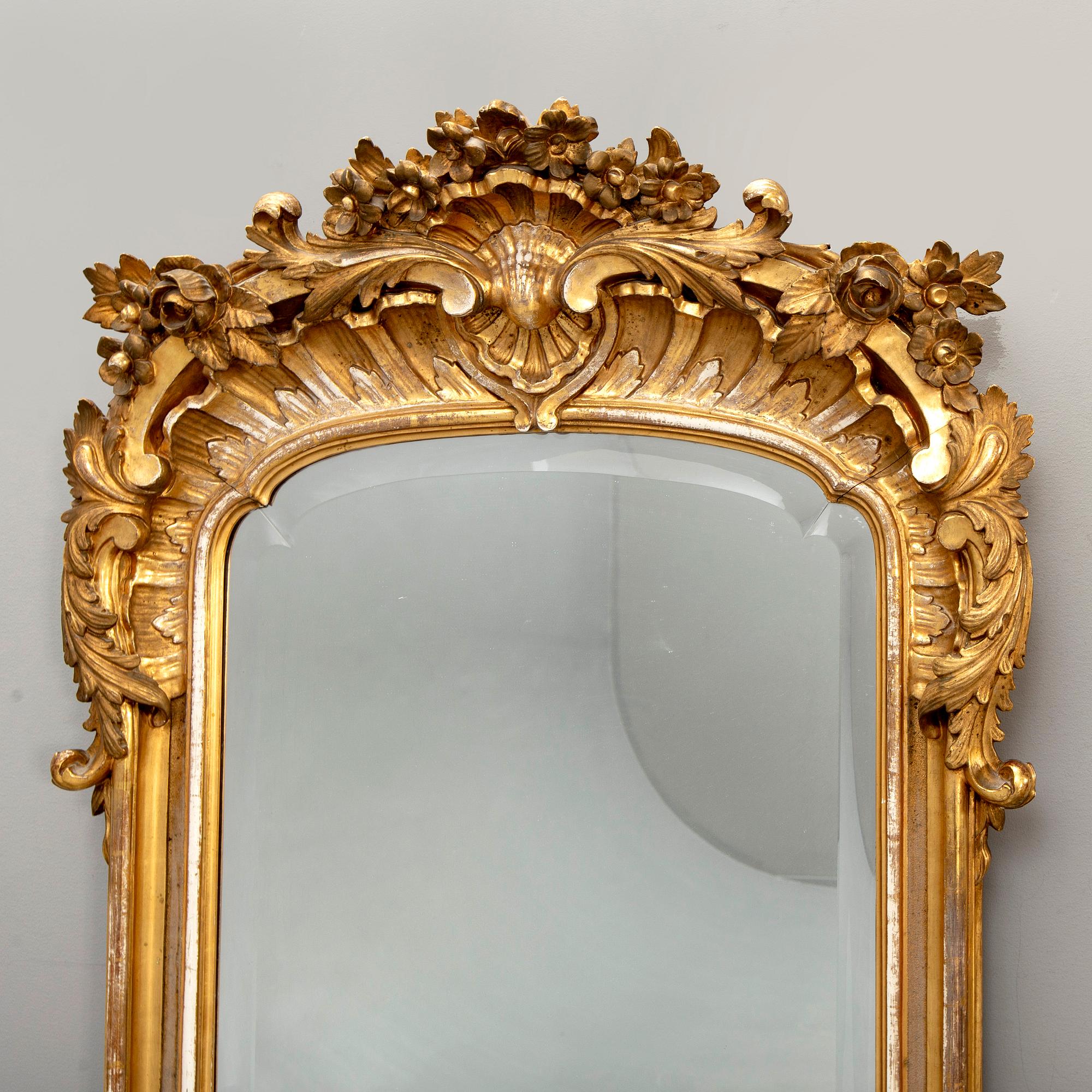 A Swedish Neo Rococo gilded signed mirror 1880s.