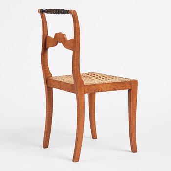 An Empire chair, first half of the 19th century.