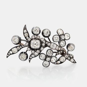 A gold and silver brooch set with old-cut diamonds, 19th century.