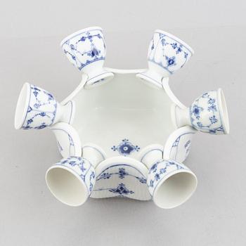 A set with six egg servers, a stand and a salt shaker, "Blue fluted"/"Musselmalet", Royal Copenhagen, part 19th century.