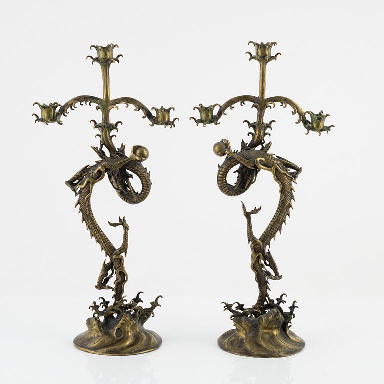 A pair of brass candelabra, Japan, early 20th century.