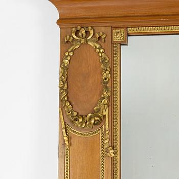 An Empire style mirror, around the year 1900.