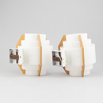 Hans-Agne Jakobsson, a pair of beech and plastic wall light, Markaryd, second half of the 20th century.