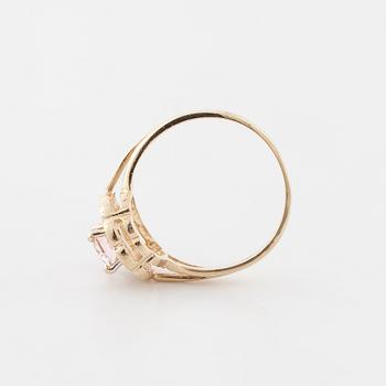 A morganite and brilliant cut diamond ring.