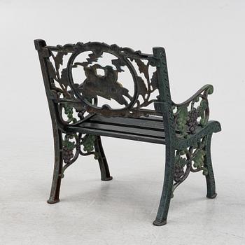 A children's cast iron garden sofa and armchair, mid 20th century.