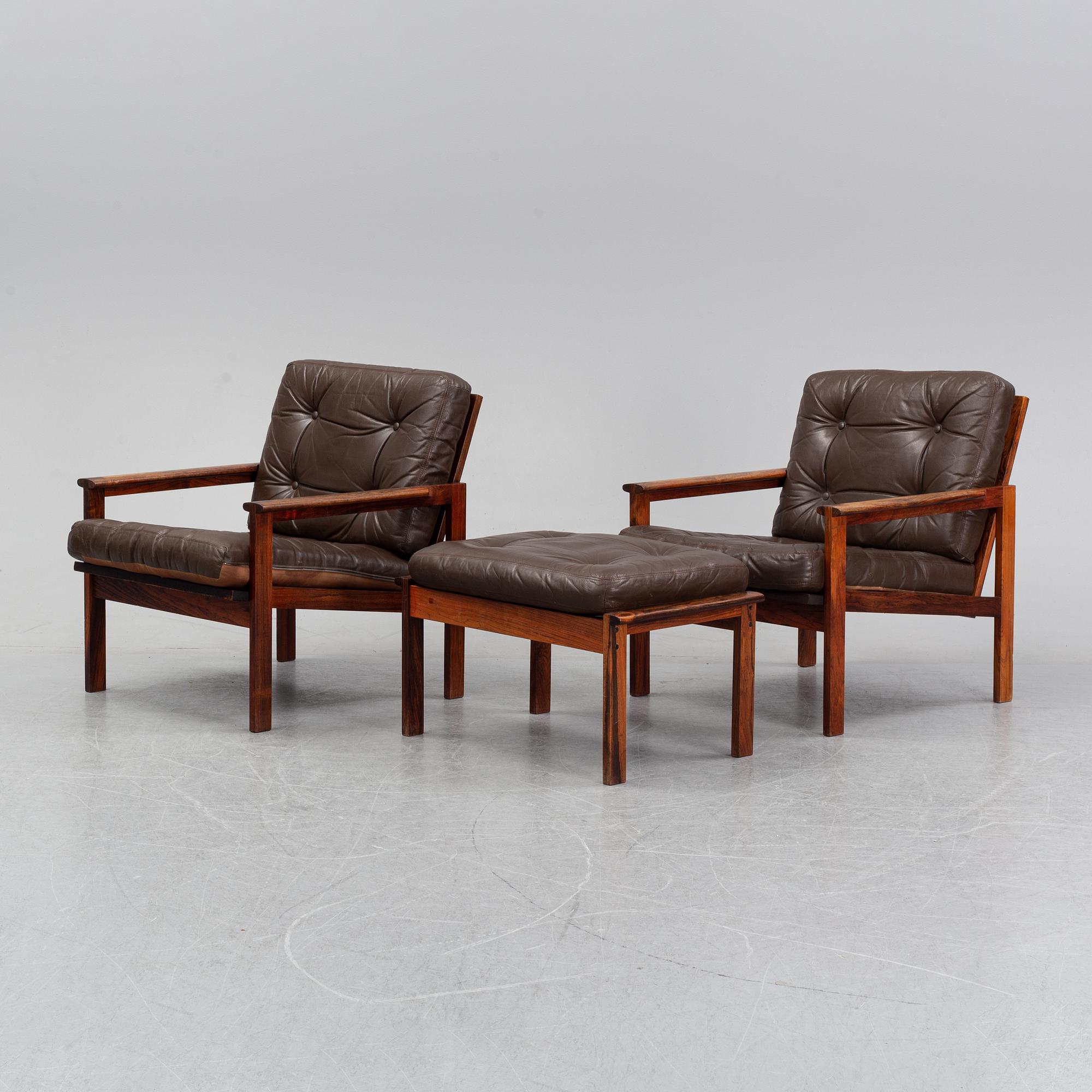 Illum Wikkelsö, a pair of 'Capella' easy chairs and one stool. Eilersen, Denmark. Designed 1959.