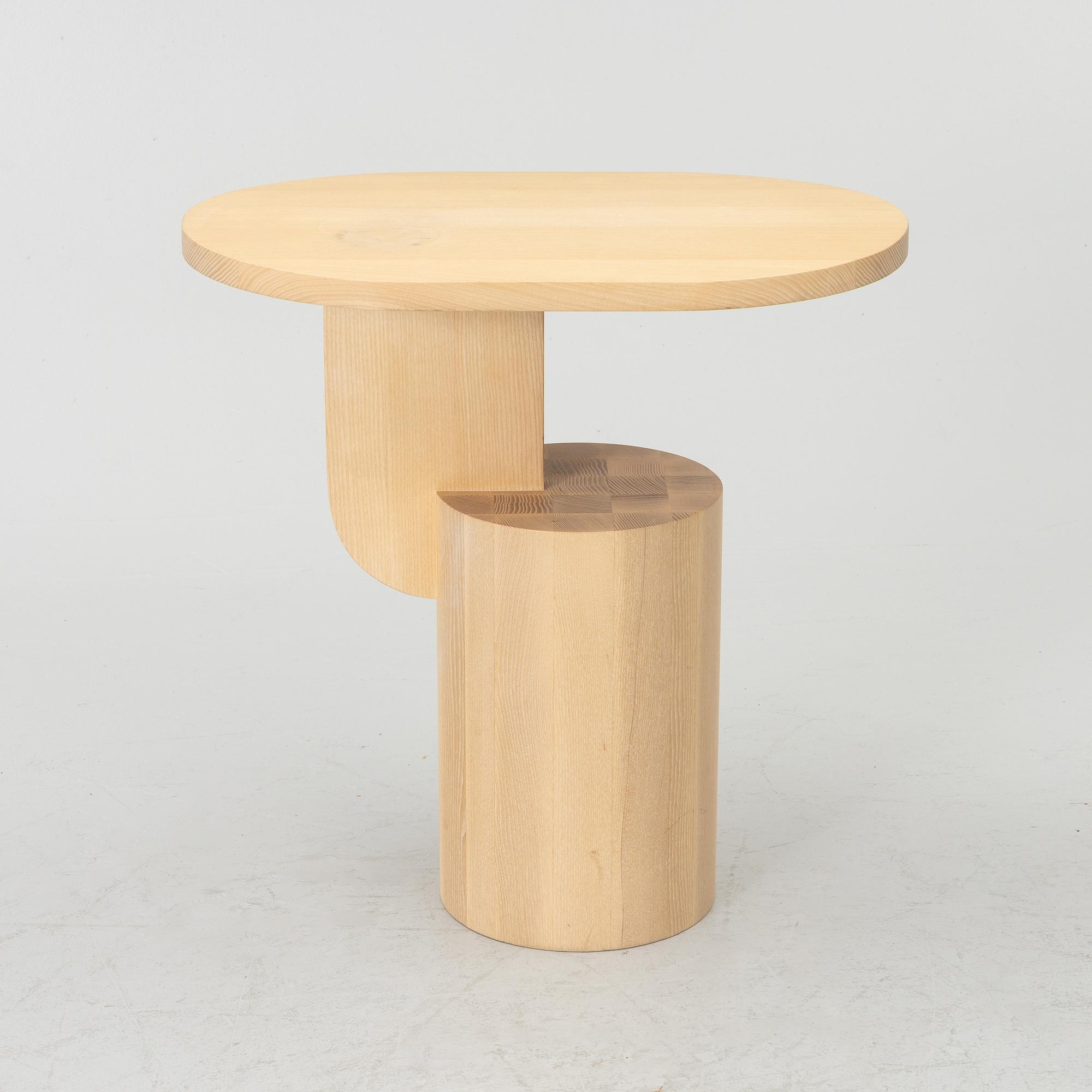 An 'Insert' side table, Firm Living.