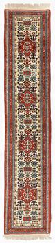An oriental runner, c. 355 x 75 cm.
