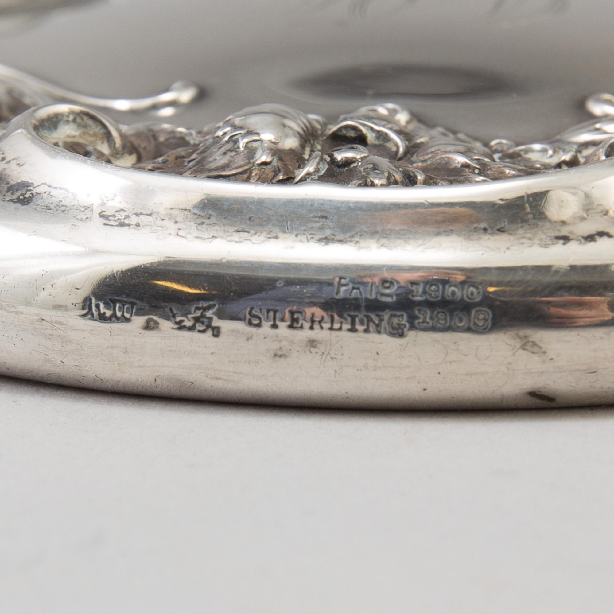 A sterling silver mirror from around year 1900.