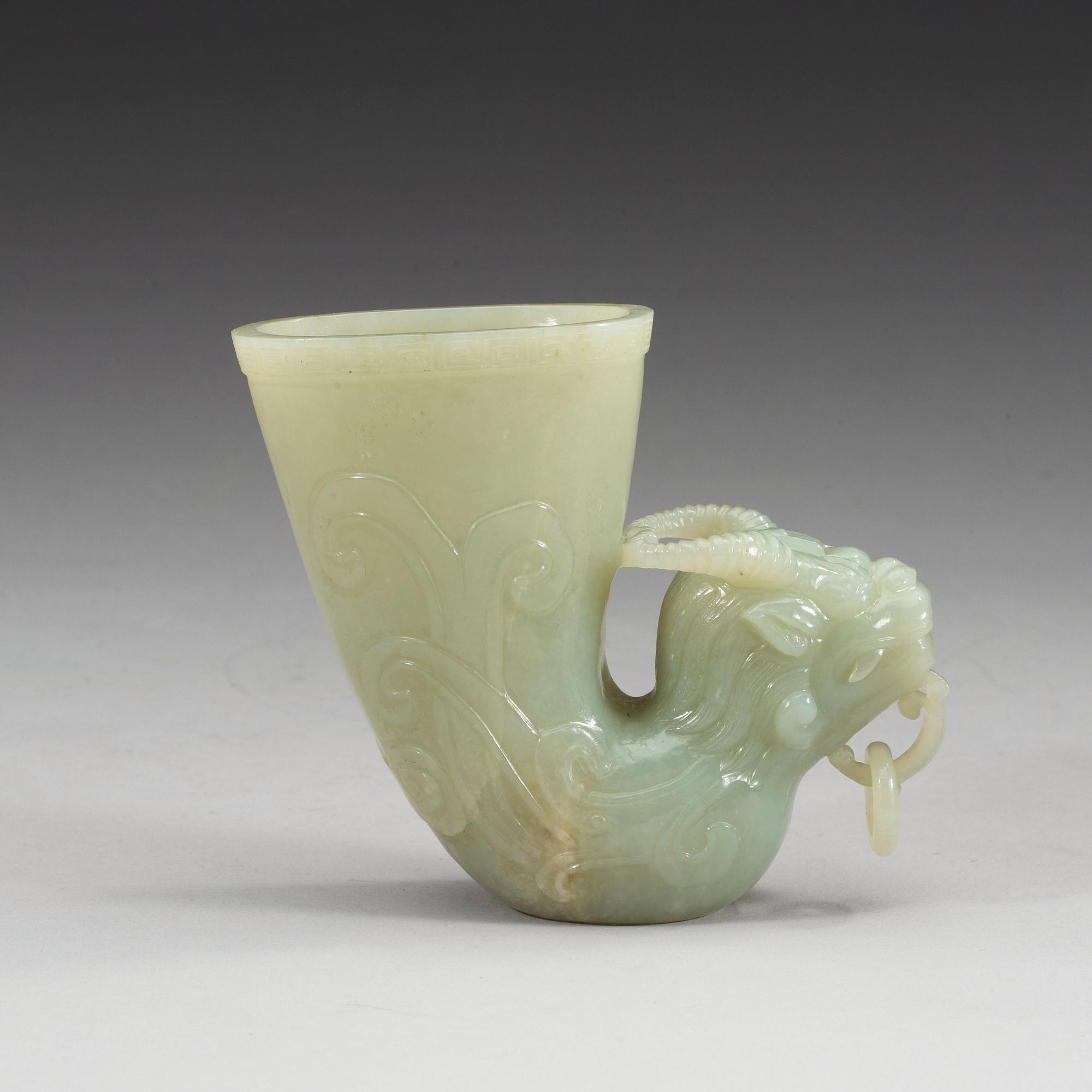 A Chinese carved nephrite rhyton beaker.