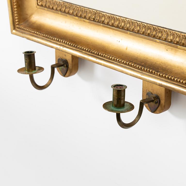 A pair of Empire giltwood two-branch girandole mirrors, Sweden, first part 19th century.