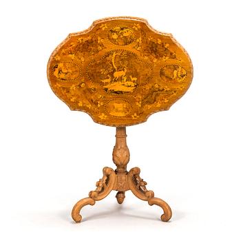 A Russian marquetry tilt-top table from the 1870s.