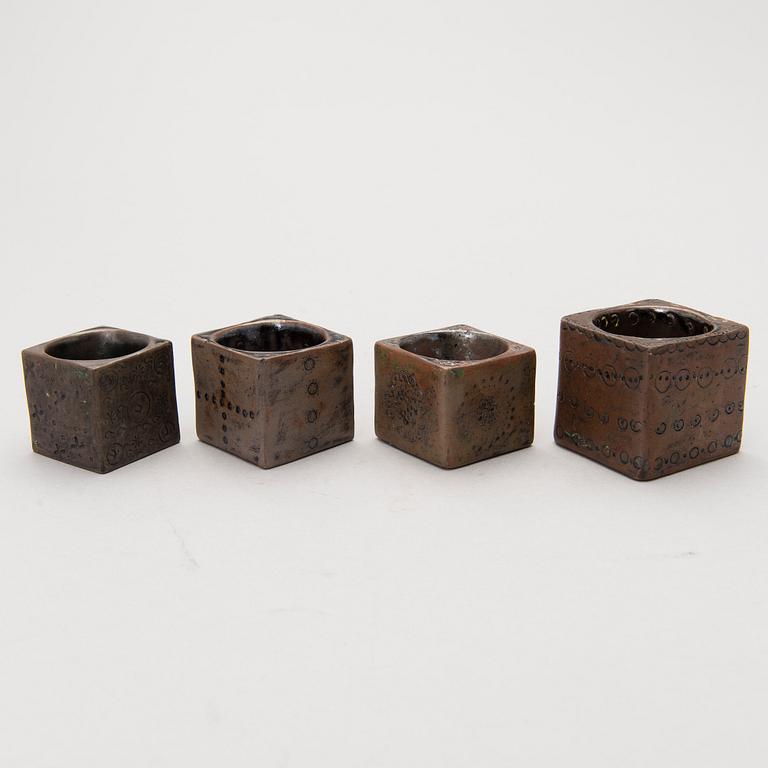 Four stoneware cruets, signed Bryk.