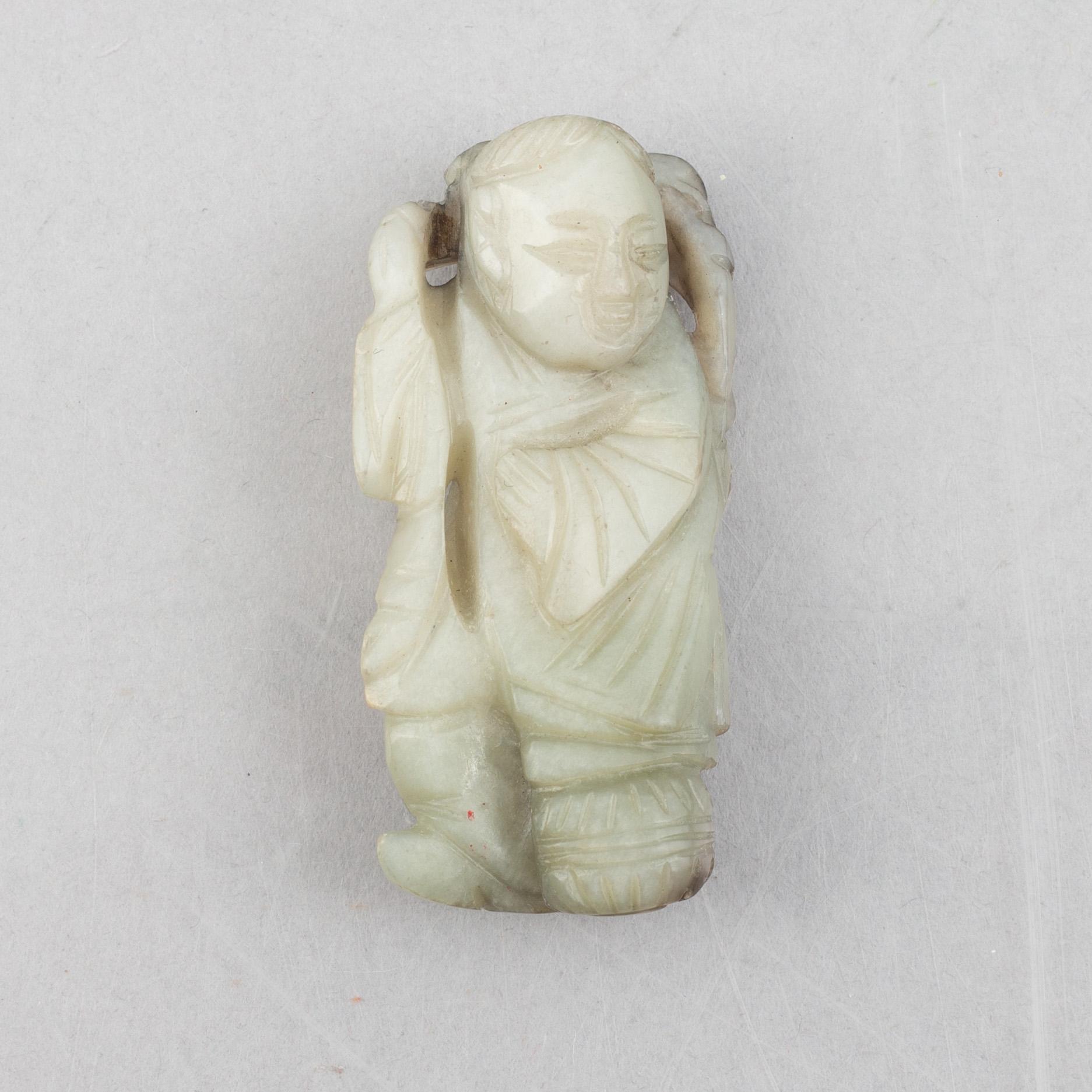 A group of four Chinese stone charms, 20th century.