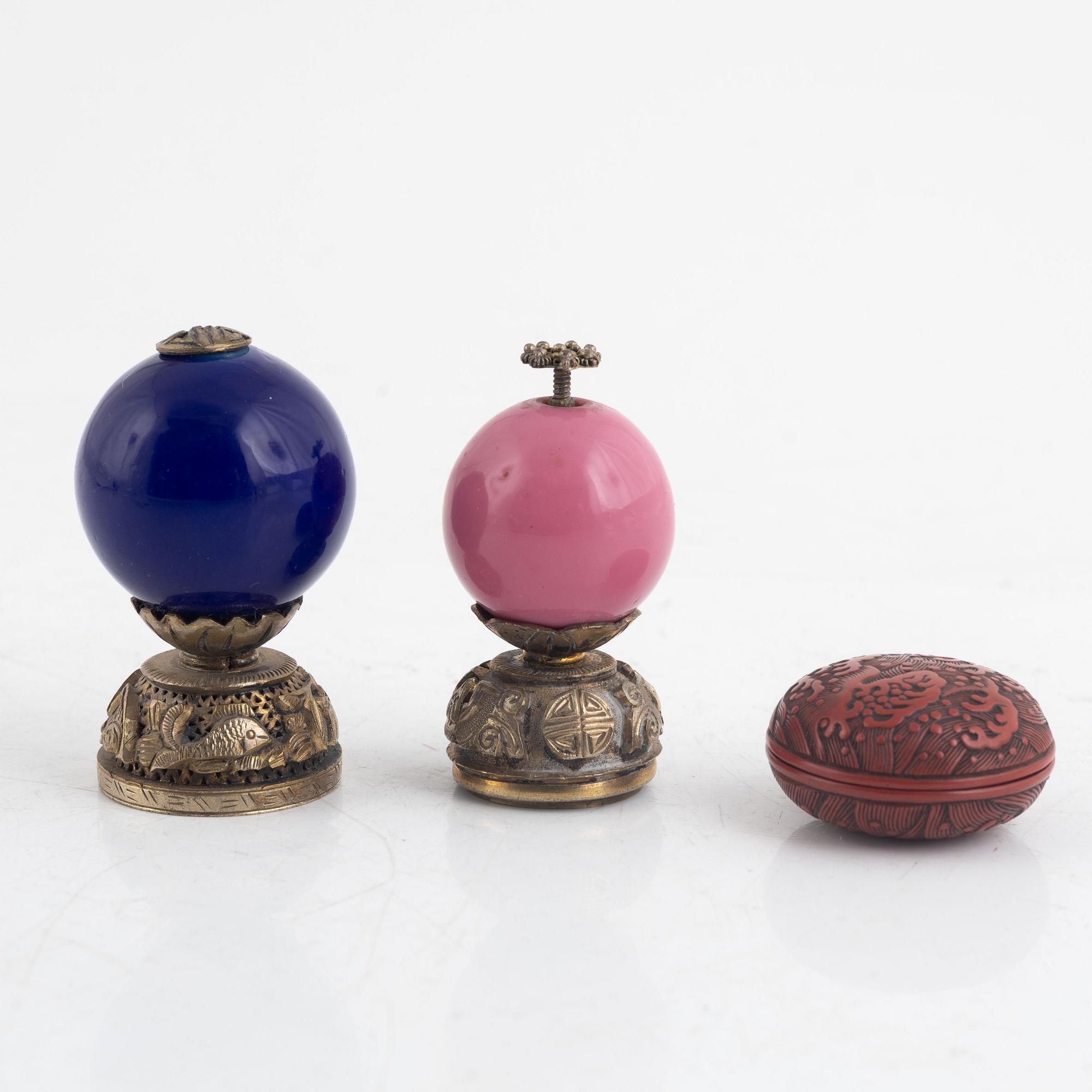 Two Chinese hat finials / mandarin insignias and a red lacquer box / button, late Qing dynasty.