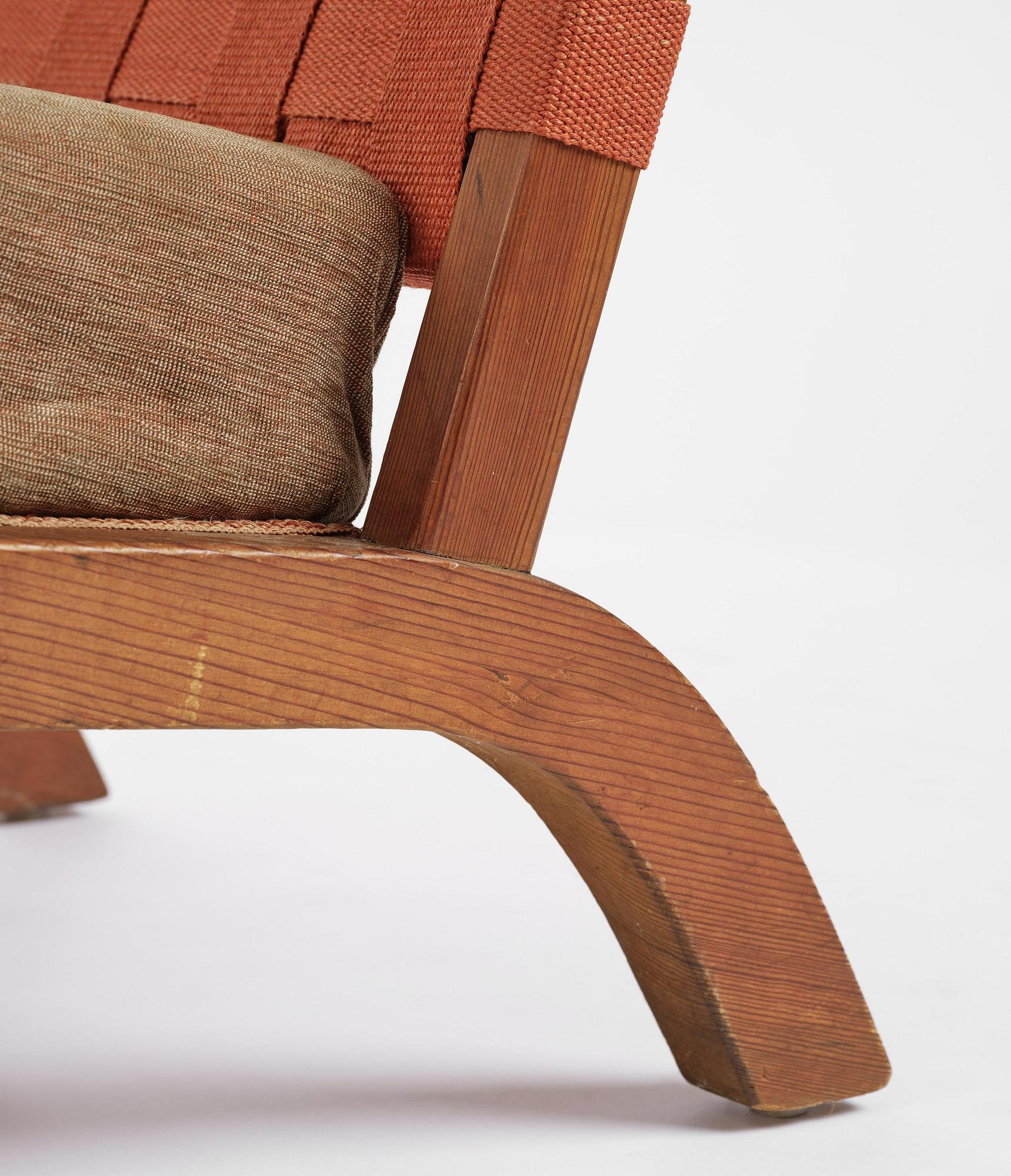 Axel Einar Hjorth, a pair of stained pine "Väddö" easy chairs, Nordiska Kompaniet, Sweden, 1930s-40s.