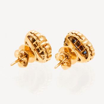 A pair of 18K gold earrings set with round brilliant-cut diamonds and square-cut sapphires.