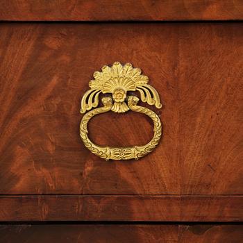 A French Empire mahogany commode, early 19th century.