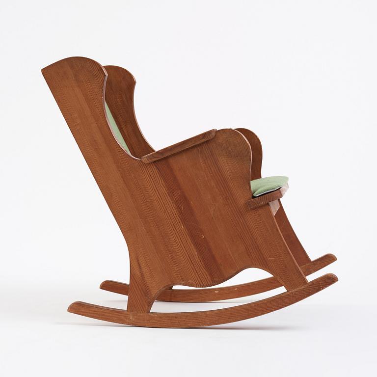 Nordiska Kompaniet, a Swedish Modern stained pine 'Lovö' rocking chair, 1940s.