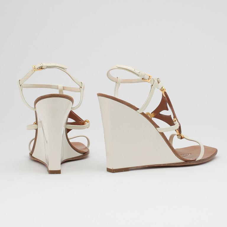 LOUIS VUITTON, a pair of white wedge heel sandalettes.