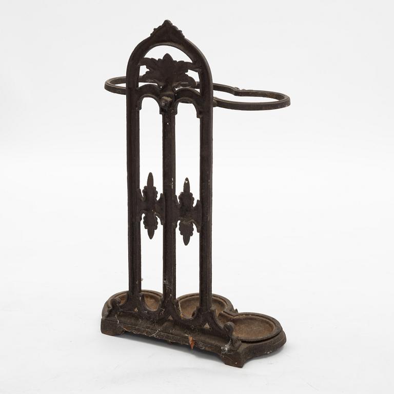 A cast iron umbrella stand, circa 1900.