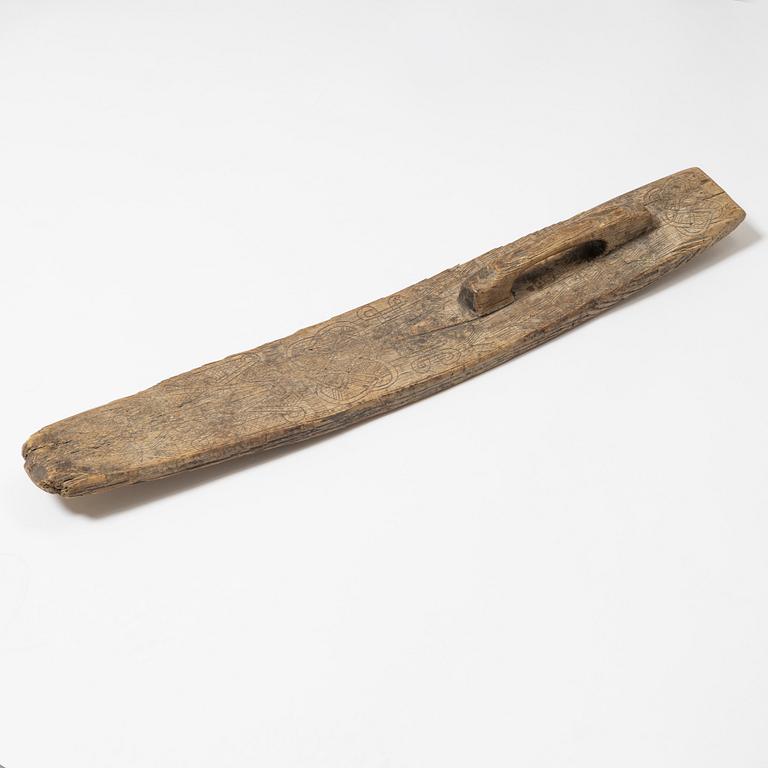 A Swedish folk art mangle board, dated 1666.