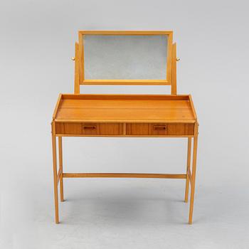 A teak make-up table from the second half of the 20th-century.