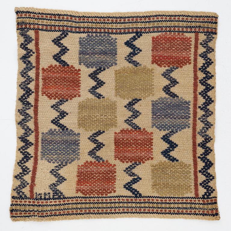 Märta Måås-Fjetterström, a textile, "Skaftblomman", flat weave, c 38 x 37 cm, signed MMF.