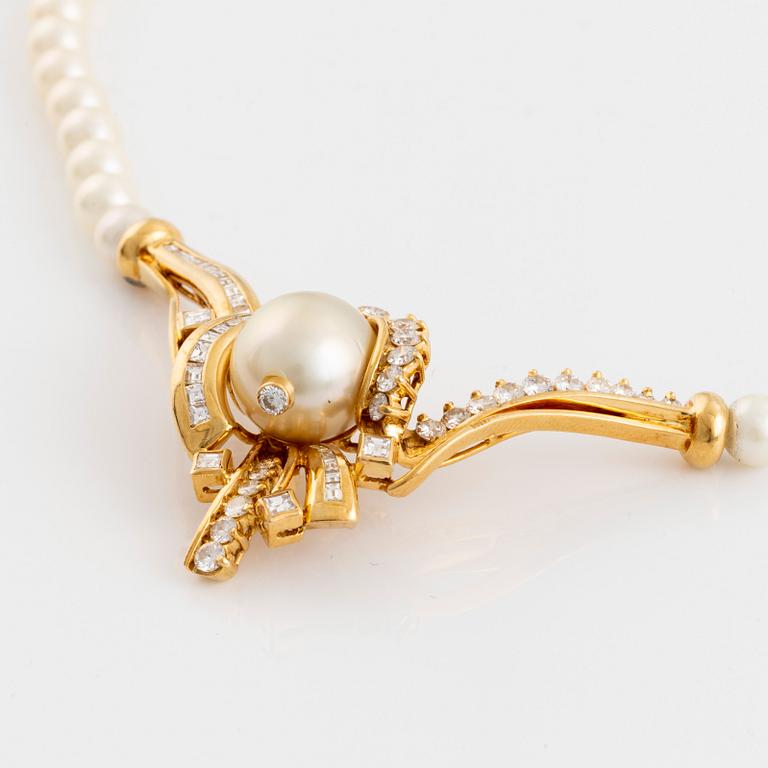 Pearl and baguette- and brilliant cut diamond necklace.