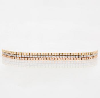 1007. An 18K gold bracelet set with round brilliant-cut diamonds.