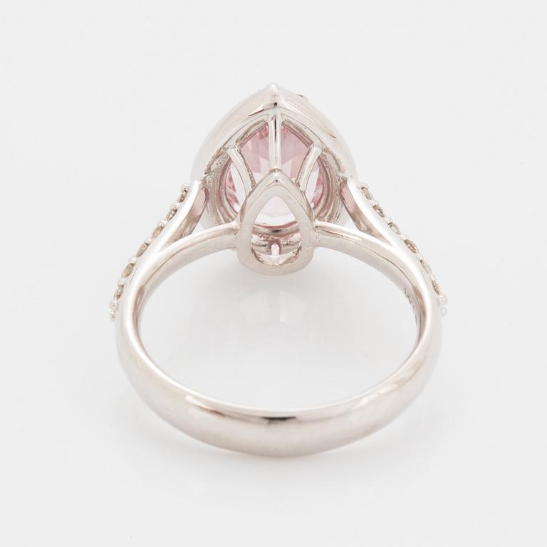 An 18K gold ring set with a faceted morganite.